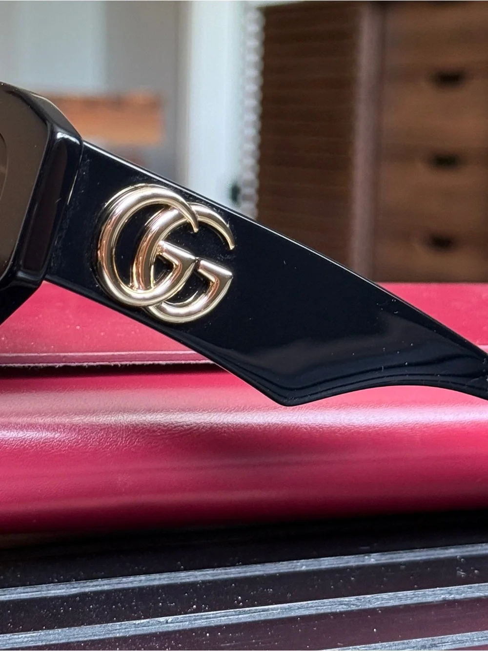 Gucci Black Oval Women's Sunglasses with Dark Lenses